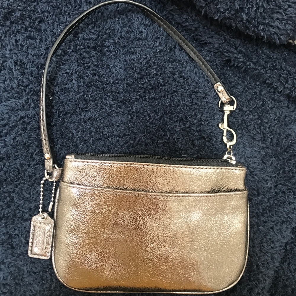 Metallic coach wristlet bag